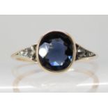 A yellow metal diamond and blue gem set ring size M, weight 1.6gms Condition Report: