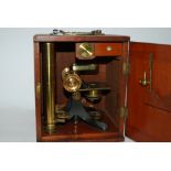 A brass microscope in fitted case Condition Report: Available upon request