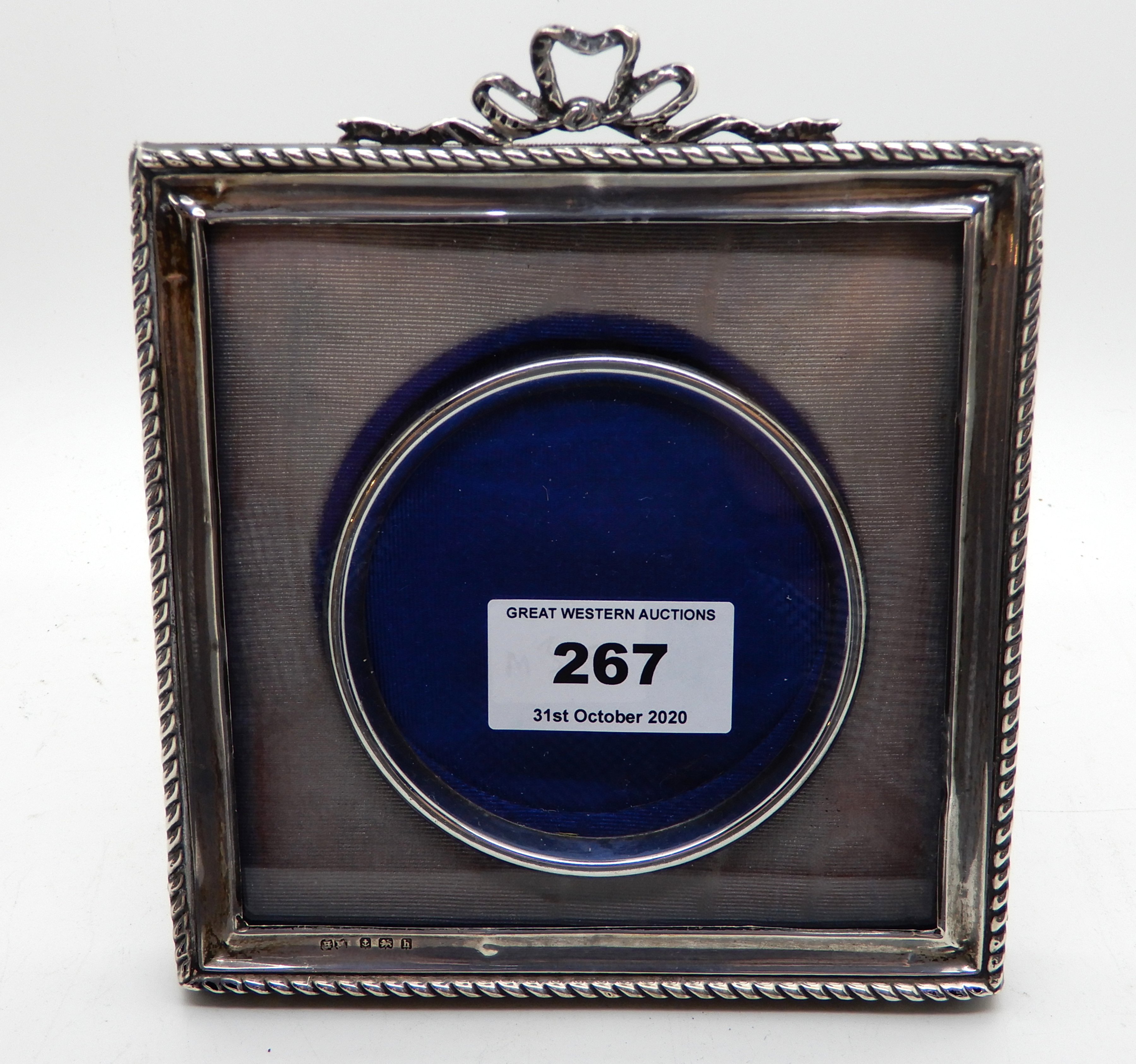 A silver mounted photo frame, Birmingham 1907, 13.5cm square, aperture 8cm diameter Condition