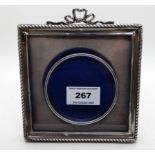 A silver mounted photo frame, Birmingham 1907, 13.5cm square, aperture 8cm diameter Condition