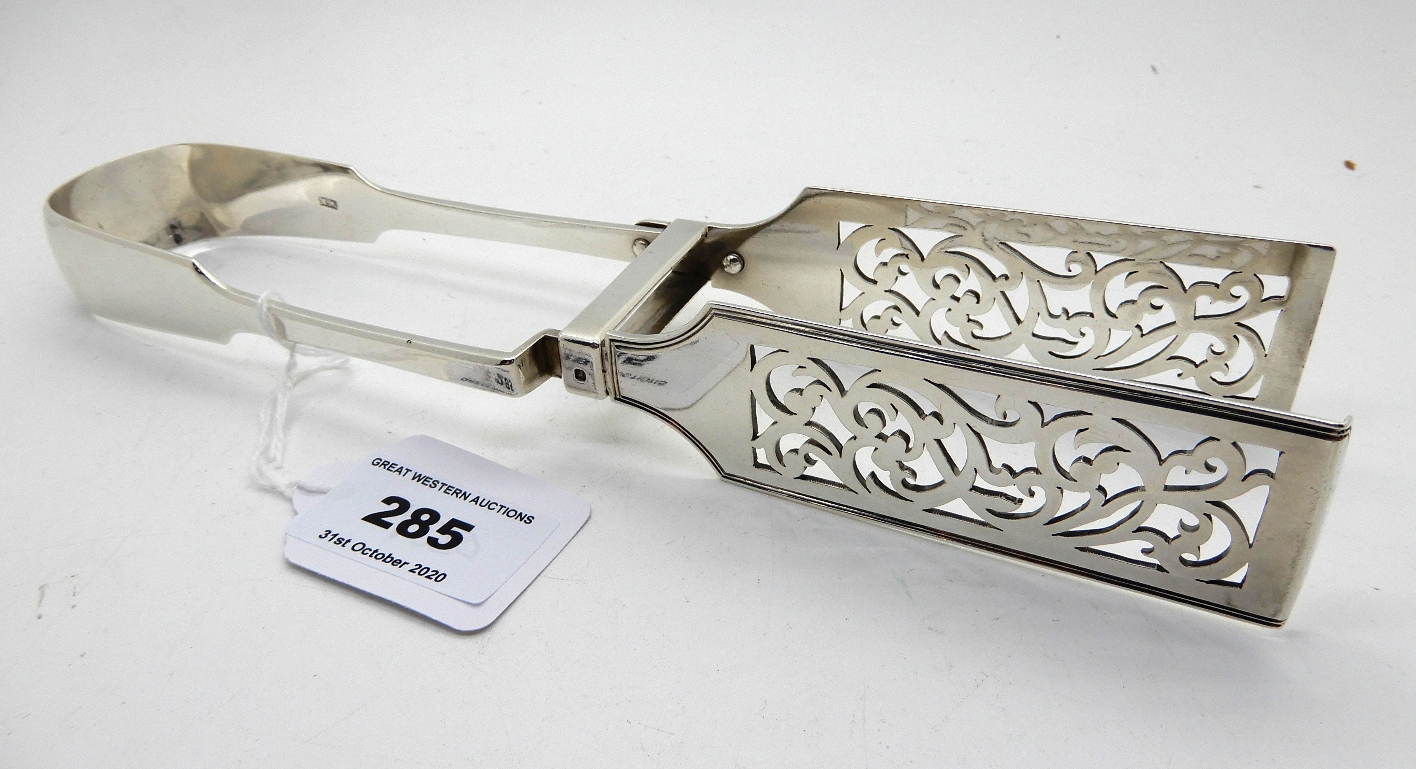 A pair of silver asparagus tongs, unclear London marks, 24cm long, 164gms Condition Report: