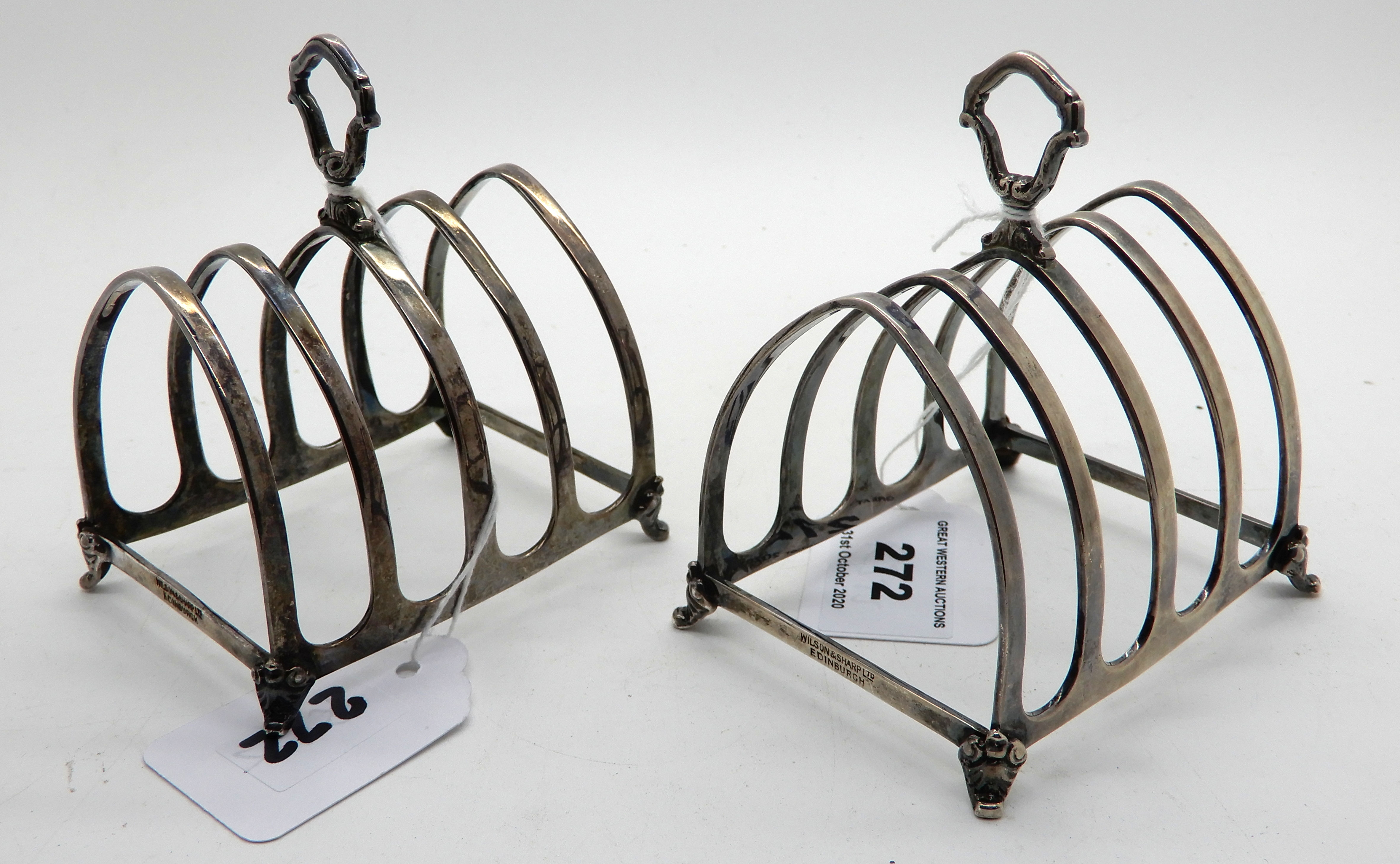 A pair of silver toastracks, Birmingham 1932 and 1933, 168gms Condition Report: Available upon