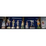 Eight Royal Worcester Days of the Week figures including two different examples of Saturday,