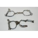 Two pairs of hand cuffs, two cast-metal figures of soldiers etc Condition Report: Available upon