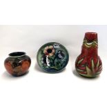 A small Moorcroft Pomegranate pot, 7cm high, a anemone dish, 11cm diameter and a Minton Secessionist