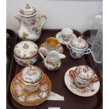 A Naples Capodimonte chocolate cup, cover and saucer, a chocolate pot, sugar bowl, jug and