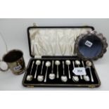 A lot comprising a cased set of twelve coffee spoon, a silver christening mug and a white metal