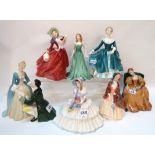 Seven Royal Doulton figures including The Suitor, Daydreams, Paisley Shawl, Emerald, Janine,