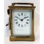 A French brass cased carriage clock Condition Report: Top panel and front panel with slight chips to