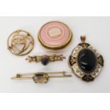 A yellow metal onyx and enamel morning locket, a 9ct thistle brooch, a 9ct Mackintosh brooch, a