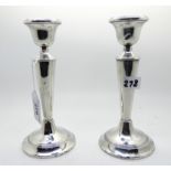 A pair of silver candlesticks, London marks, 17cm high (weighted) Condition Report: Available upon