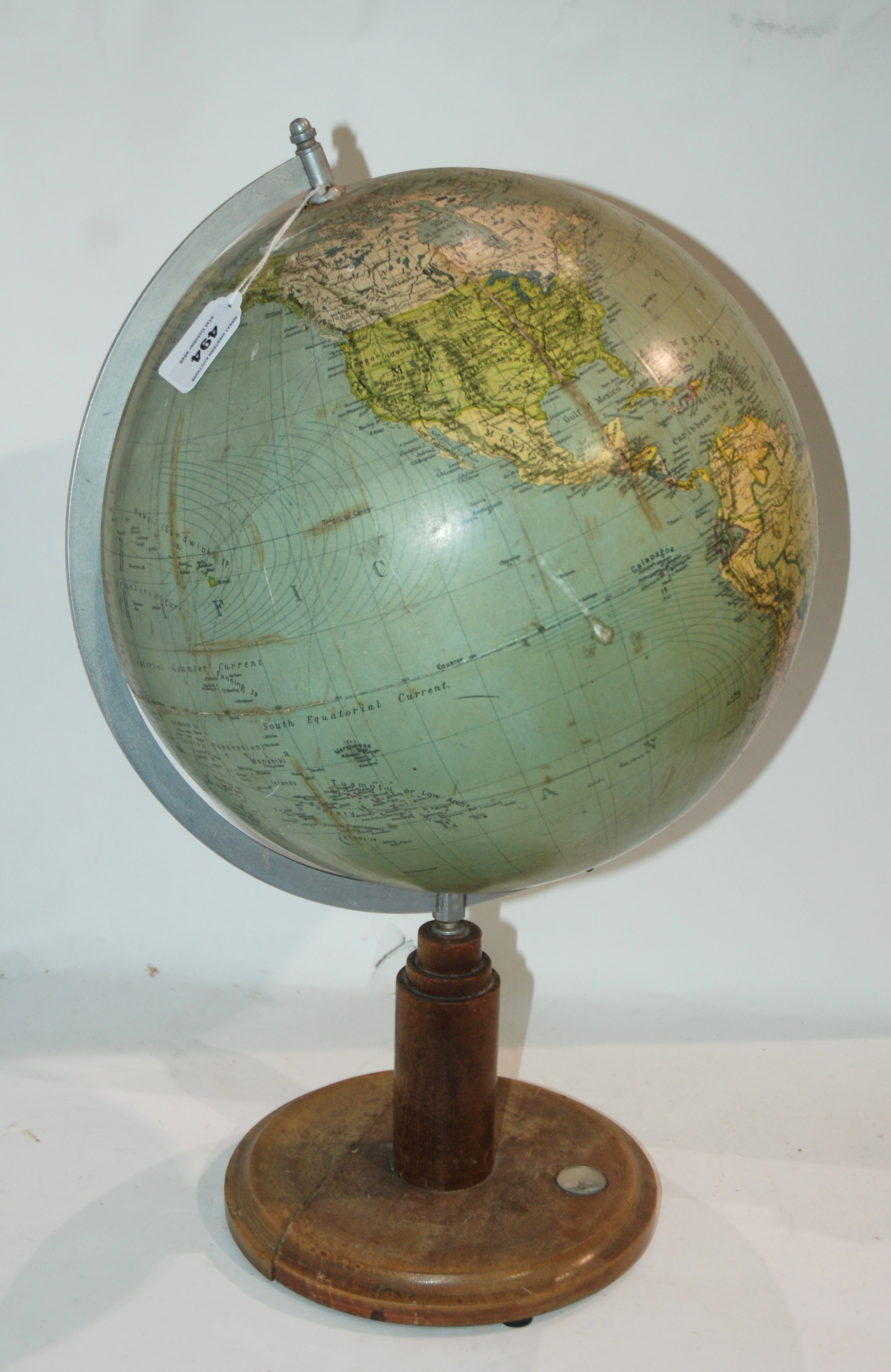 A 20th Century globe on stand, 52cm high and a green-painted fire extinguisher (2) Condition Report: