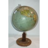 A 20th Century globe on stand, 52cm high and a green-painted fire extinguisher (2) Condition Report: