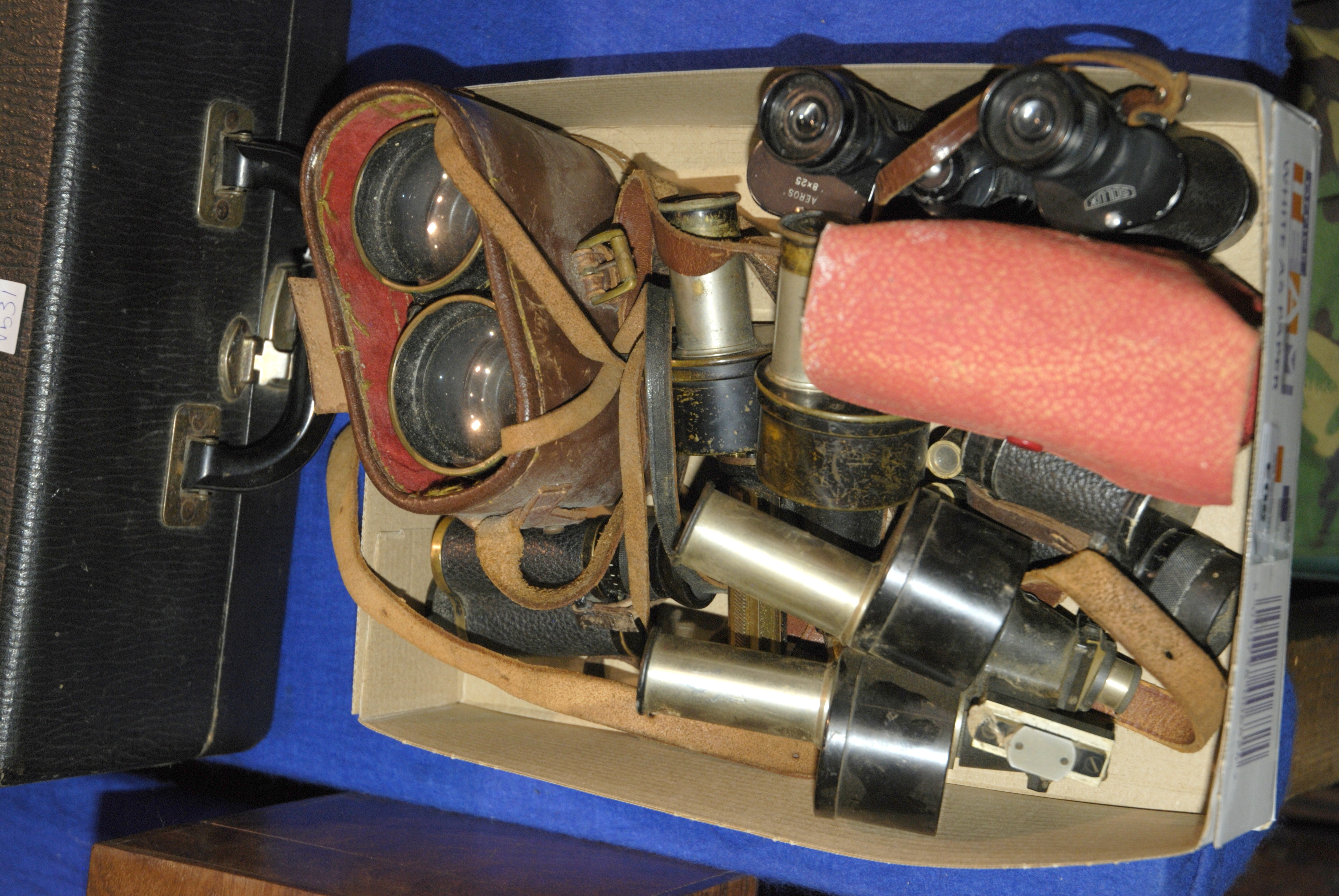 A small collection of binoculars, microscope lenses etc Condition Report: Available upon request