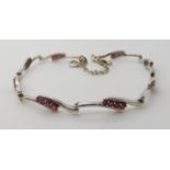 A 9ct white gold ruby set bracelet, weight 5.9gms Condition Report: Available upon request