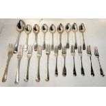 A lot comprising twenty assorted silver spoons and forks, 919gms Condition Report: Available upon