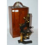 A brass microscope by W. Watson and Sons in fitted case Condition Report: Available upon request