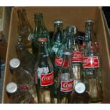 Sixteen various coke bottles and small collection of Broons and Oor Wullie annuals Condition Report: