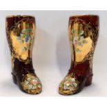 A pair of Italian red glass boots with painted and gilt decoration Condition Report: Available