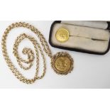 A 1910 gold half sovereign in 9ct gold pendant mount with chain and a gold One Dollar coin pin