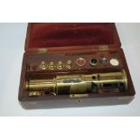 A brass scope in fitted mahogany case and another mahogany box (2) Condition Report: Available