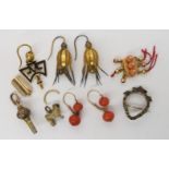 A 15ct gold coral set clasp, a yellow metal red and green gem set luckenbooth brooch and other items
