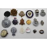 A lot comprising assorted military badges, other badges, a whistle and a watchhead Condition Report: