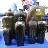 Assorted tapering green glass gin bottles including small examples for A.C.A Nolet and P.