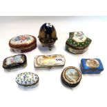 Seven porcelain trinket boxes and a glass example Condition Report: Available upon request