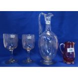 A etched glass jug with two matching glasses and a cranberry jug Condition Report: Available upon