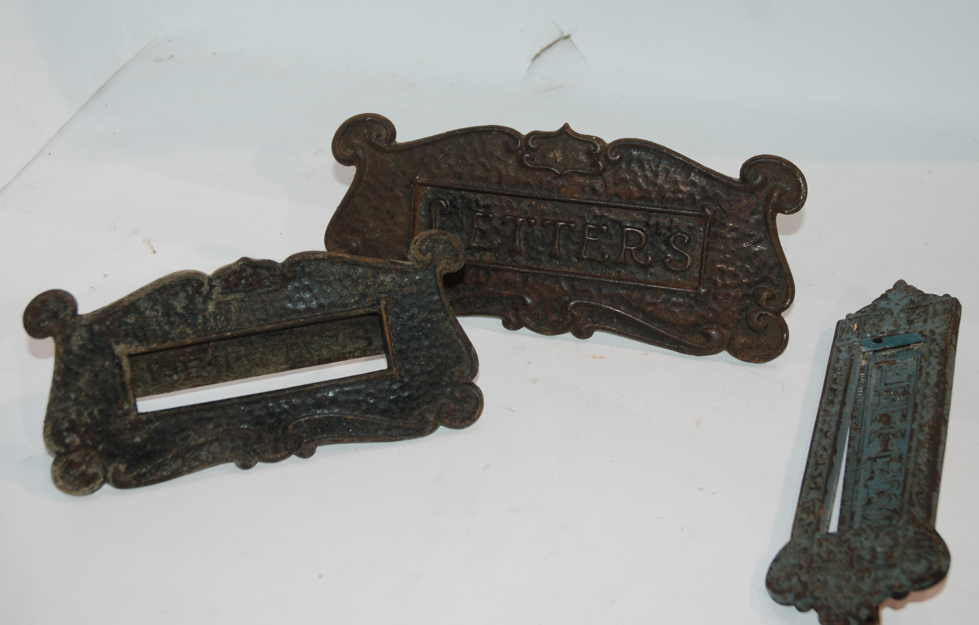 Three vintage letter box plates, shoe last, iron etc Condition Report: Available upon request