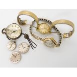 A 9ct gold cased ladies Omega, a gold plated example, three Omega ladies watch movements, and a