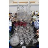 A collection of cut glass including a pair of decanters, jug and matching glasses, other decanters