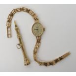 A 9ct gold ladies Everite wristwatch, and a yellow metal propelling pencil, weight combined 11.