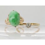 A 14k gold Chinese green hardstone ring size K, weight 3gms, together with an 18ct gold clear gem