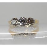 An 18ct gold three stone diamond ring of estimated approx 0.90cts combined, finger size M1/2, weight