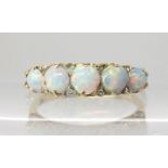 A bright yellow metal opal and rose cut diamond ring, size M1/2 weight 2.4gms Condition Report: