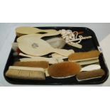 A tray lot of ivory back brushes, glove stretchers etc Condition Report: Available upon request