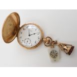 A 9ct gold Waltham pocket watch with two Masonic seals, weight combined 111.9gms Condition Report: