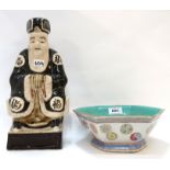 A Chinese hexagonal bowl decorated with roundel's and a pottery figure Condition Report: Available