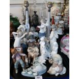 A collection of Nao and Lladro figures of children and animals, two white glazed Doulton figures etc