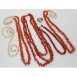 Strings of coral beads, a double string of seed pearls (af), and a yellow metal ring Condition