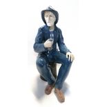 A Nao figure of a fisherman smoking a pipe Condition Report: restoredª