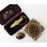 A 15ct gold brooch with a diamond set star, weight 3.4gms, a yellow metal onyx and enamel