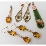 A pair of 9ct gold yellow gem set earrings, a similar pendant, 9ct ruby set earrings and a New