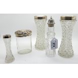 A lot comprising a pair of silver mounted glass vases, a silver topped jar, EP topped cruet bottle