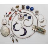 A collection of silver and costume jewellery to include a money clip by Navajo silversmith Jimmie