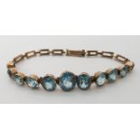 A 9ct gold blue zircon set bracelet length 15cm, weight 6.5gms Condition Report: