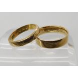 An 18ct gold flower engraved wedding ring size N1/2, and an 18ct gold mourning ring date 1893,