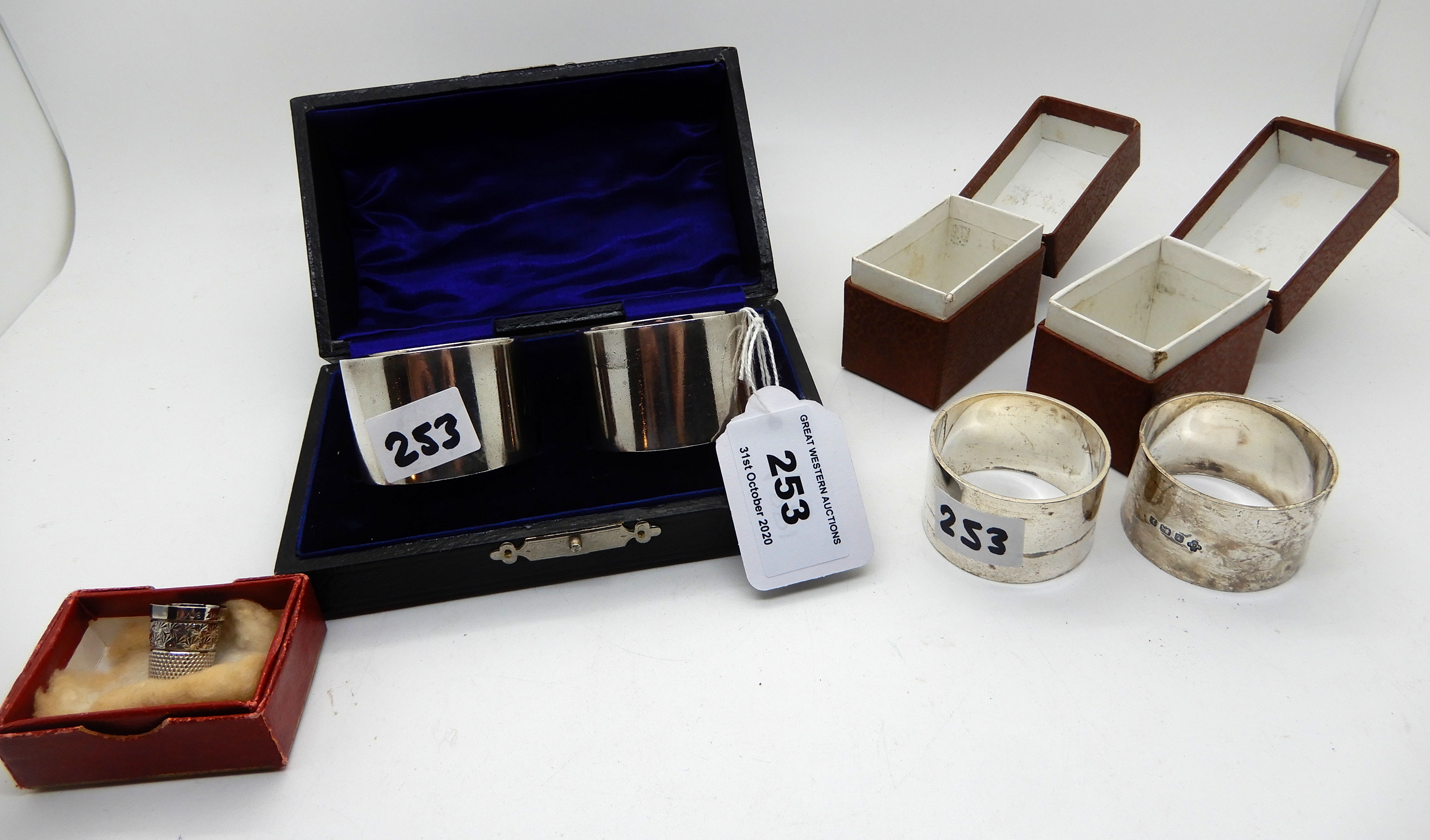 A lot comprising two pairs of cased silver napkin rings, London and Birmingham marks and a silver